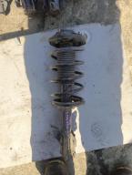 Фотография Стойка передняя левая NISSAN WINGROAD 1997г.