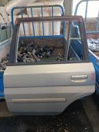Фотография Дверь задняя левая MAZDA DEMIO 2001г.